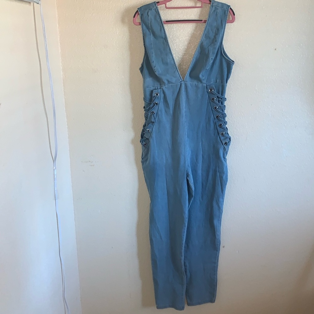 Stylish Blue Denim Jumpsuit with Lace-Up Sides
